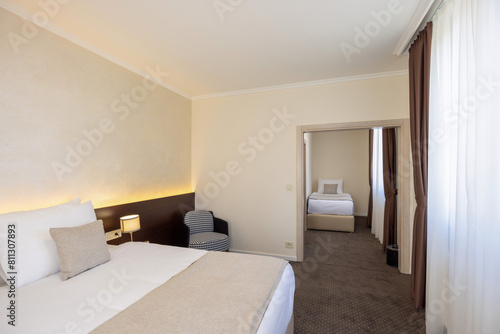 Interior of a luxury hotel double bed bedroom © rilueda