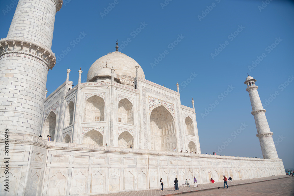 Fototapeta premium Agra, India, March 2024: The Taj Mahal, a white marble mausoleum located in Agra, Uttar Pradesh, recognized as the jewel of Muslim art in India and one of the universally admired masterpieces