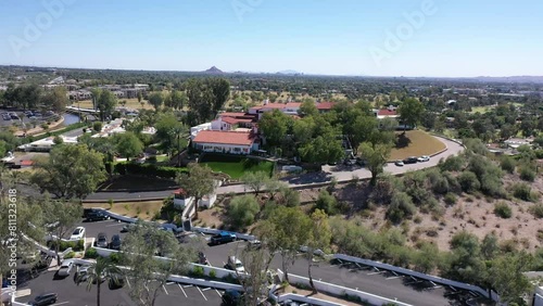 Wrigley Mansion at the Arizona Biltmore in Phoenix, Arizona with mountains and the Phoenix skyline in the background photo