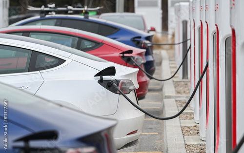 A Tesla electric vehicles at a charging station
