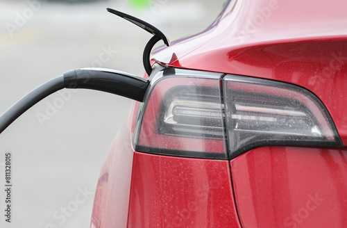 A Tesla electric vehicle at a charging station