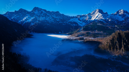 Dawn over Almsee in Upper Austria  Misty Valley with Snow-Covered Peaks and Frozen Lake