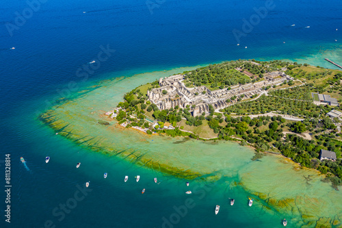 Aerial View of Sirmione Peninsula on Lake Garda, Italy, Showcasing Turquoise Waters and Vibrant Lakeside Town