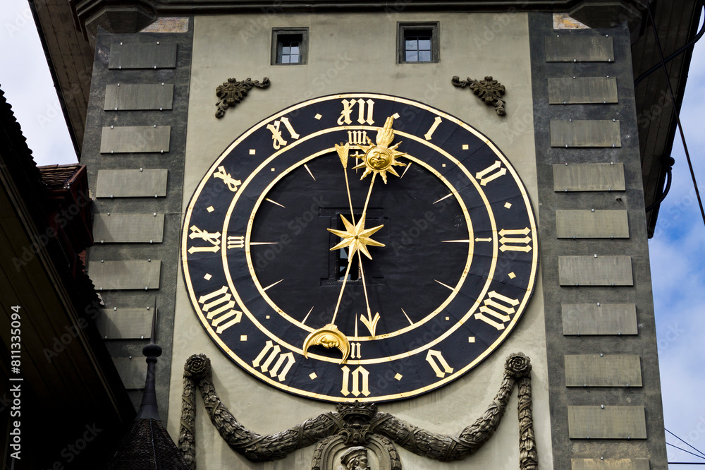 Golden and black clock in Bern, Switzerland Golden and black clock in Bern, Switzerland