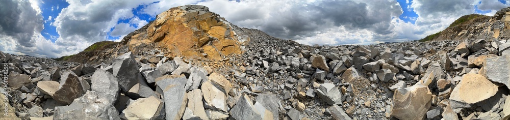 Carpathian Mountains of Ukraine, a quarry where granite sandstone is mined for the production of building materials, powerful trucks and conveyors load gravel - video from a drone Carpathian Mountains of Ukraine, a quarry where granite sandstone is mined for the production of building materials, powerful trucks and conveyors load gravel - video from a drone