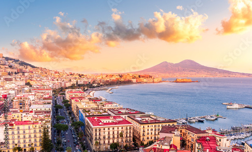 Fototapeta Naklejka Na Ścianę i Meble -  beautiful panorama of Naples city with amazing coast, sea port, streets and buildings and volcano Vesuvius with anazing sky on background