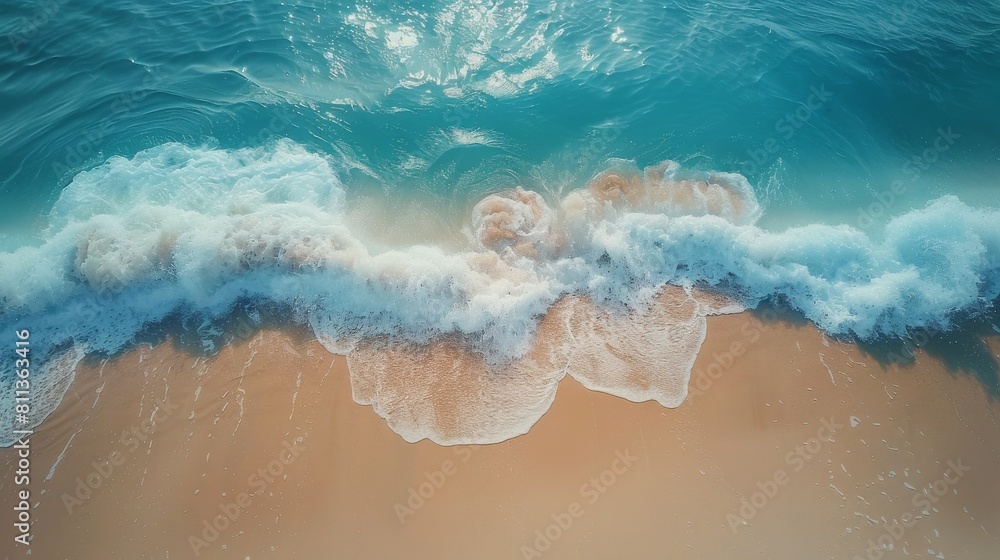 Aerial View of Ocean Waves and Sand