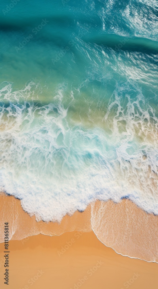Obraz premium Aerial View of Beach With Waves and Footprints