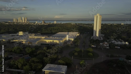 Drone lowers in front of mall at sunrise with Ponte Fernando Henrique Cardoso in the background photo