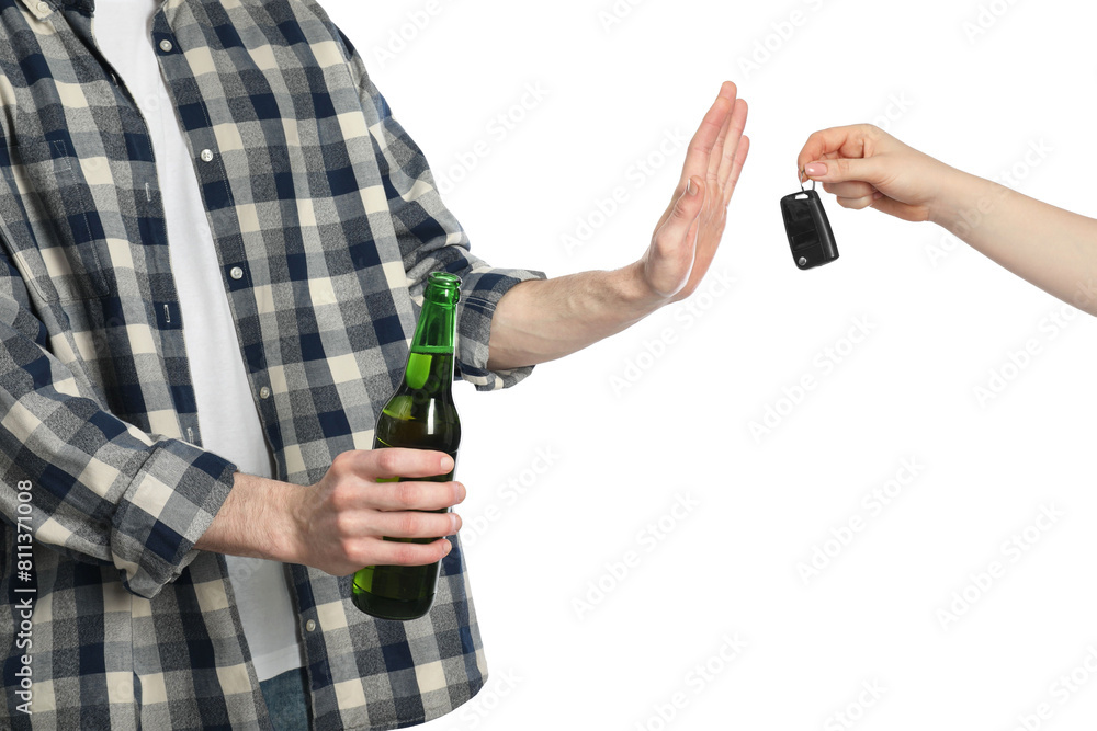 Man with bottle of beer refusing drive car while woman suggesting him keys on white background, closeup. Don't drink and drive concept Man with bottle of beer refusing drive car while woman suggesting him keys on white background, closeup. Don't drink and drive concept