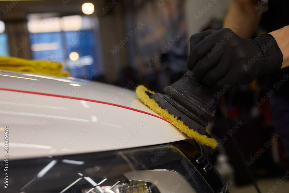 Person using machine to polish cars automotive exterior Person using machine to polish cars automotive exterior