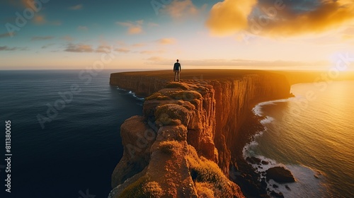 Man standing on top of cliff at sunset , back view or no face Generative AI photo