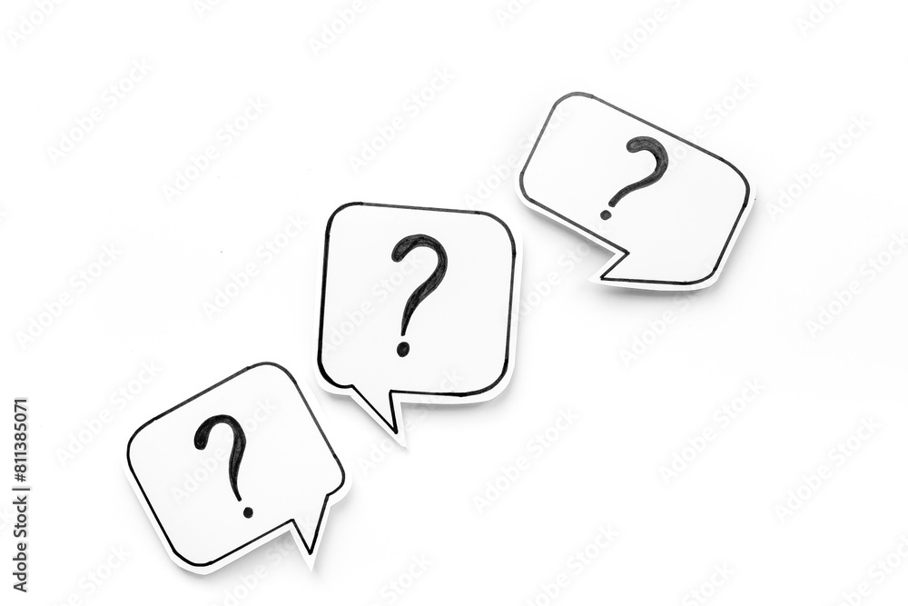 FAQ concept - paper speech bubbles with question mark, top view