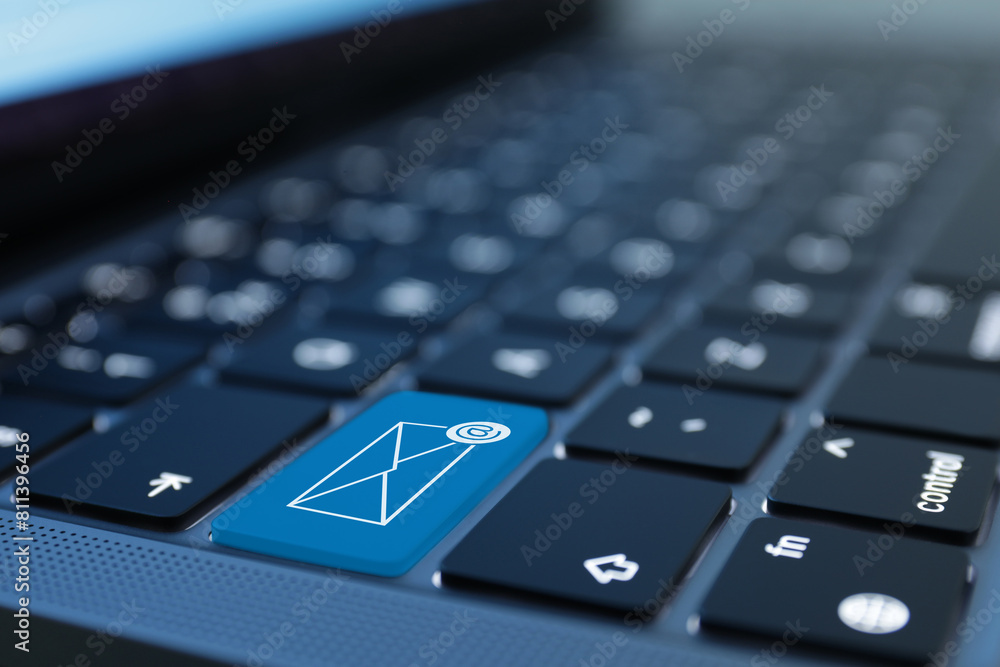 Light blue button with illustration of envelope and email sign on laptop keyboard, closeup Light blue button with illustration of envelope and email sign on laptop keyboard, closeup