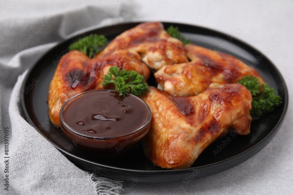 Fresh marinade and chicken wings on light table, closeup Fresh marinade and chicken wings on light table, closeup