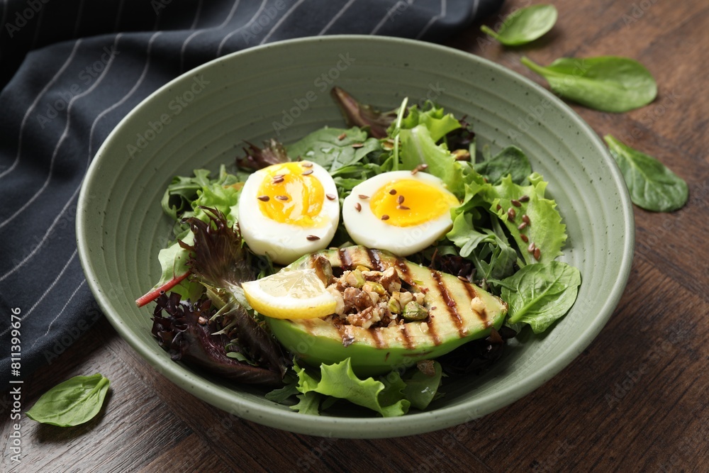 Healthy dish high in vegetable fats on wooden table, closeup Healthy dish high in vegetable fats on wooden table, closeup