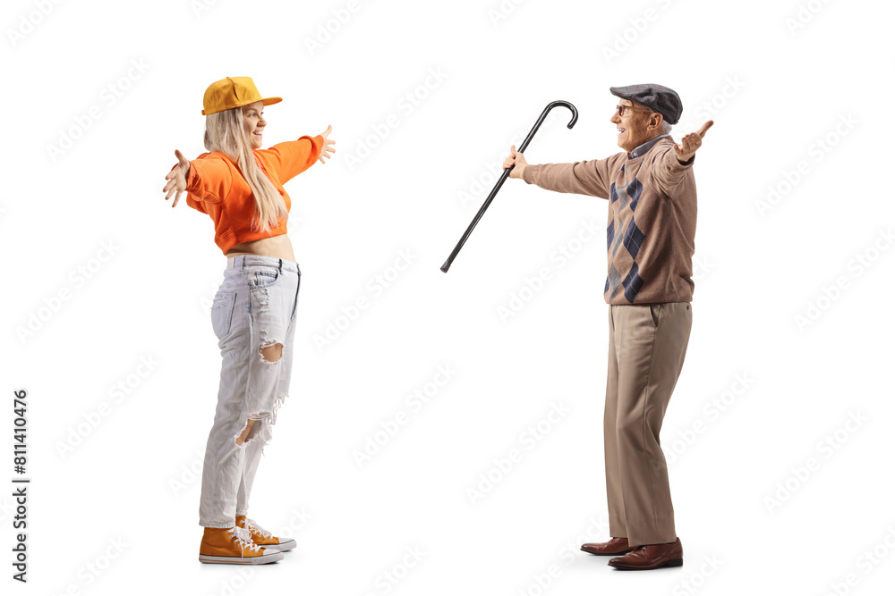 Full length profile shot of a young teenage female meeting elderly man Full length profile shot of a young teenage female meeting elderly man