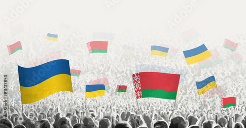 People waving flag of Belarus and Ukraine, symbolizing Belarus solidarity for Ukraine.