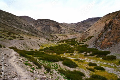 View of picturesque mountain landscape as seen from the hiking trail crossing the Ganda La pass (4980 m) and leading to Markha valley (Hemis National Park, Ladakh, India)