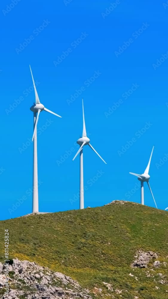Green renewable alternative energy concept - wind generator turbines generating electricity. Wind farm on Crete island, Greece Green renewable alternative energy concept - wind generator turbines generating electricity. Wind farm on Crete island, Greece