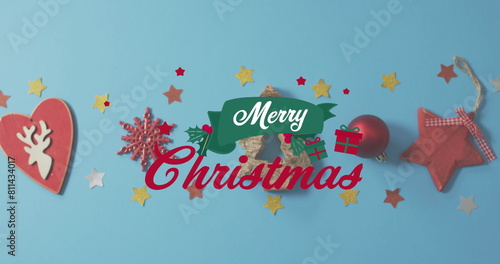 Various Christmas decorations are scattered on blue background