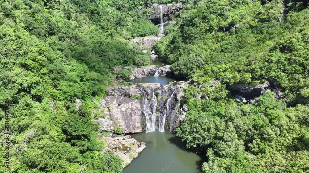 Aerial landscape video view of Tamarind Falls, aka Seven Cascades in the tropical island jungle of Mauritius surrounded by lush green forested mountains, flying from a lower pond to the top - footage Aerial landscape video view of Tamarind Falls, aka Seven Cascades in the tropical island jungle of Mauritius surrounded by lush green forested mountains, flying from a lower pond to the top - footage