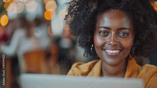 Collaborating with Smiles: Multiethnic Business Women Working on Laptop in Corporate Office - Wide Shot with Depth of Field