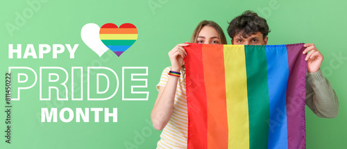 Young couple with LGBT flag...