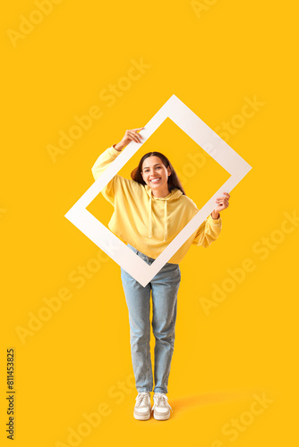 Young woman in hoodie with ...