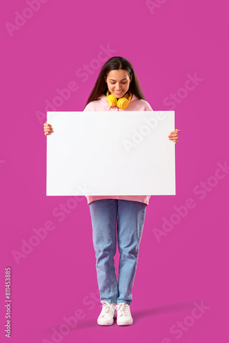 Young woman in hoodie with ...