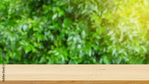 empty table top wooden counter podium in outdoor tropical garden forest blurred green. Generative Ai