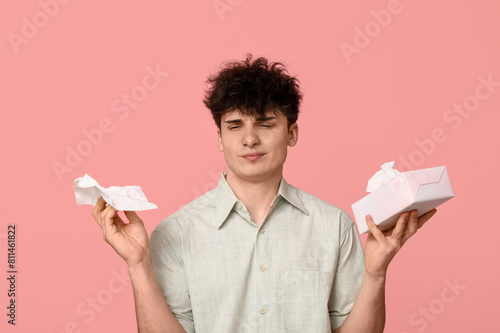 Young man with tissues on p...