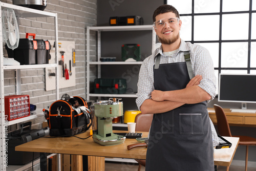 Male repairman with coffee ...