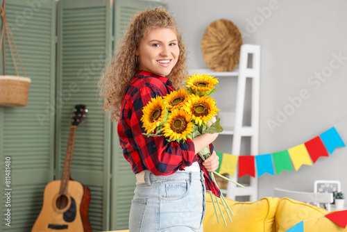 Happy young woman with bouq...