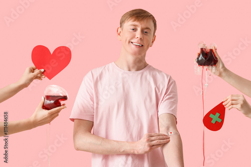Male blood donor and hands ...