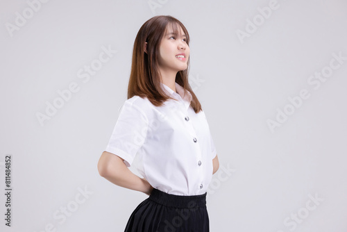 Pretty Asian woman in university student uniform over isolated white background.