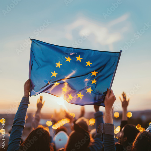A photo of the European flag waving in front people