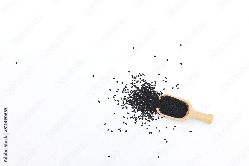 Black cumin, black seed, scattered seeds, on a white background, free space, place for text, top view Black cumin, black seed, scattered seeds, on a white background, free space, place for text, top view