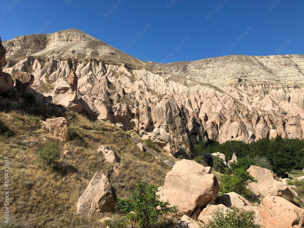 Fototapeta premium Aerial drone shot of the Fairy Chimneys over the landscape of Goreme, Cappadocia.