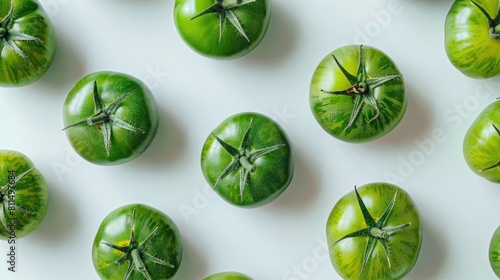 Herbed green tomatoes on a white background separated