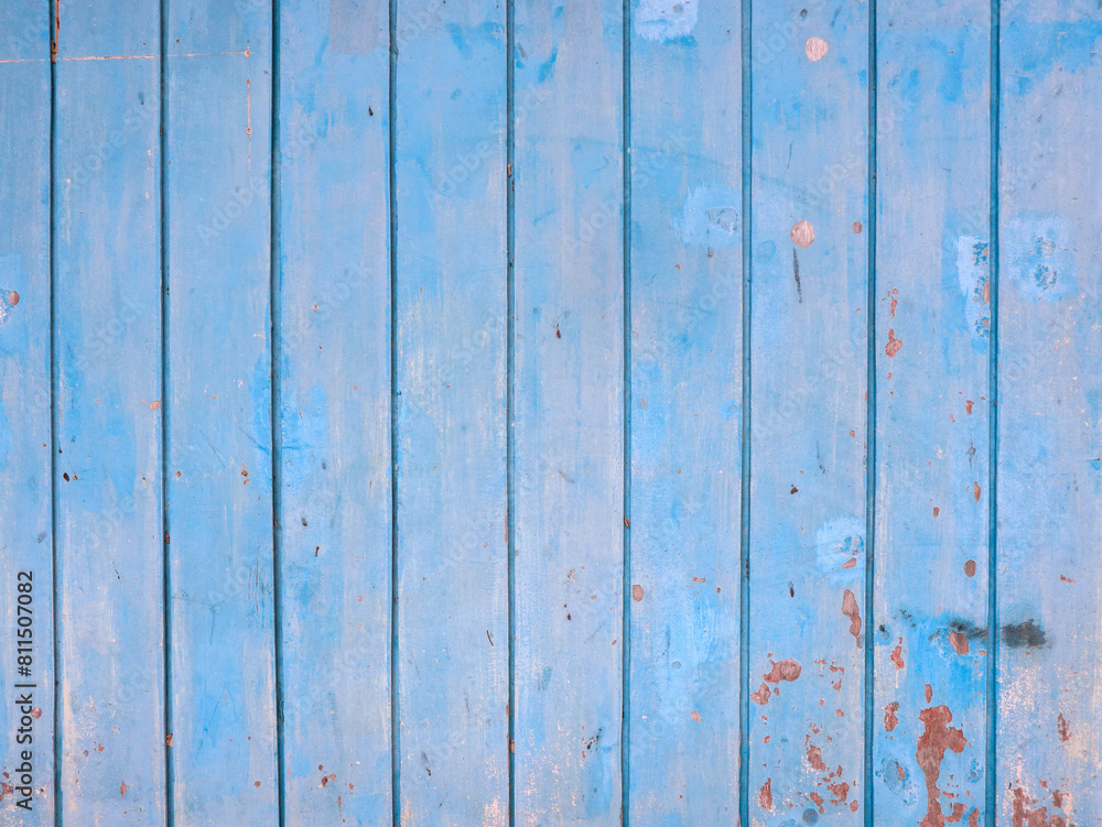background of old wooden blue planks whose paint is faded and peeling background of old wooden blue planks whose paint is faded and peeling
