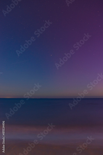 May 11, 2024, the phenomenon of the Northern Lights visible when observing the sky in Tuscany. Aurora borealis reflected in the sea. San Vincenzo, Tuscany, Italy