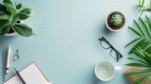 workspace with a notebook, glasses, pen, coffee cup and plants on a blue background. © admin_design