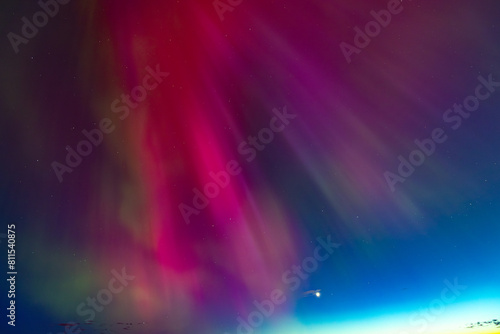 Northern lights at the zenith of the sky. Aurora Borealis or Northern Lights Latvia. Northern lights shining in the sky