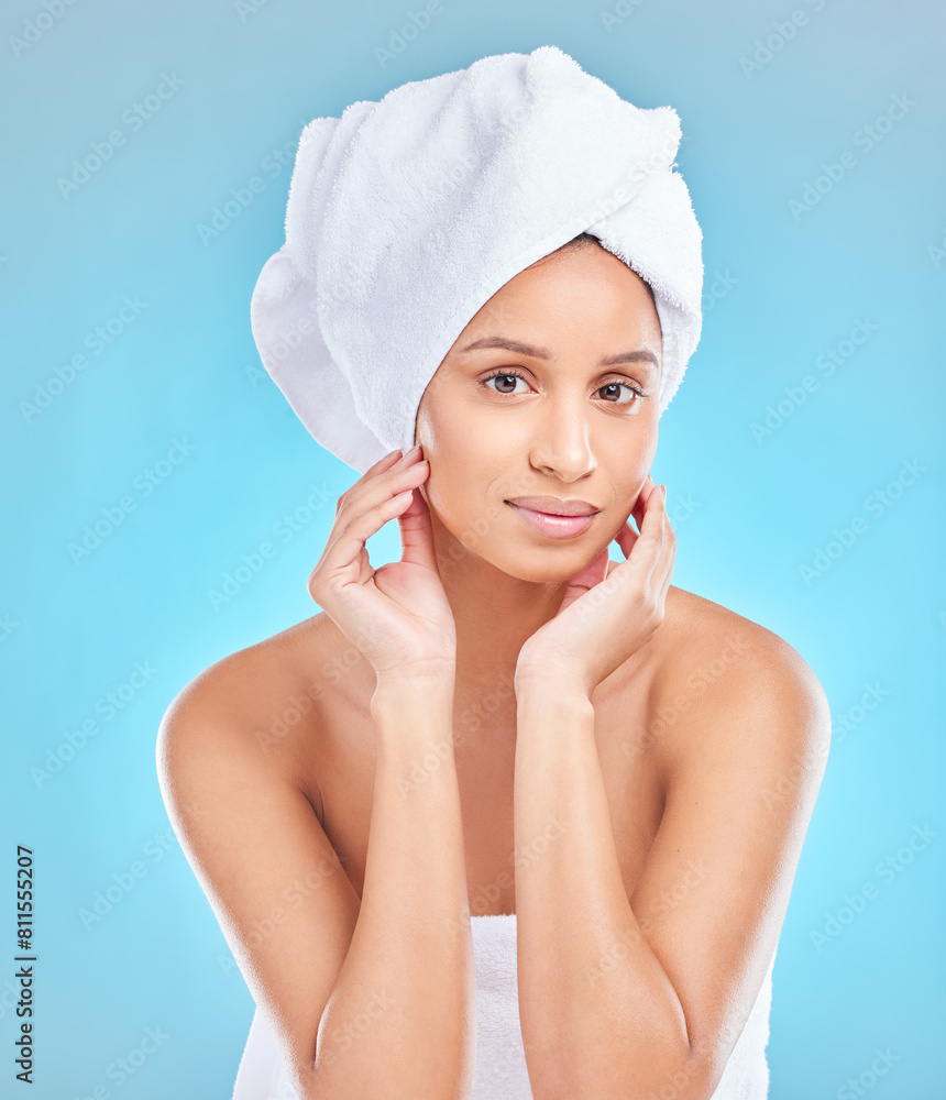 Beauty, towel and portrait of Indian woman with natural facial shine with dermatology cosmetics in studio. Skincare, blue background and clean face of girl model with healthy glow results or wellness Beauty, towel and portrait of Indian woman with natural facial shine with dermatology cosmetics in studio. Skincare, blue background and clean face of girl model with healthy glow results or wellness