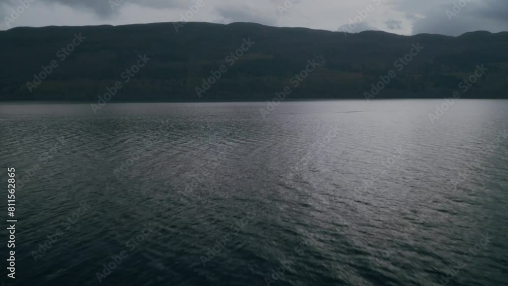 Fast low flight over Loch Ness looking over the Scottish Highlands, dolly in Fast low flight over Loch Ness looking over the Scottish Highlands, dolly in