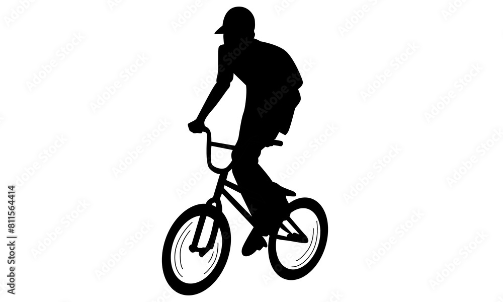 Obraz premium silhouette of boy showing off freestyle trick with bicycle