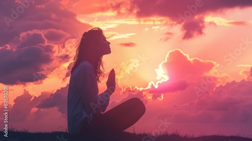  woman kneeling down praying for worship God at sky background  Christians pray to jesus christ for calmness  In morning people got to a quiet place and prayed