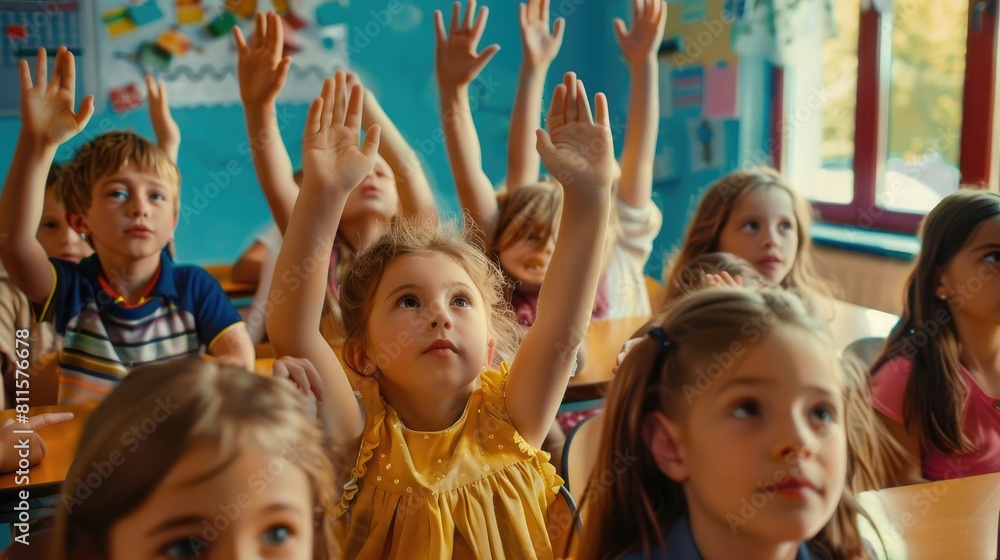 Shot of an unrecognizable group of children sitting in their school classroom and raising their hands to answer a question