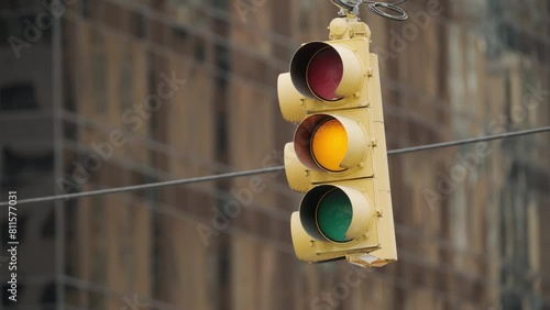 Traffic light in New York City changing from green to red close up